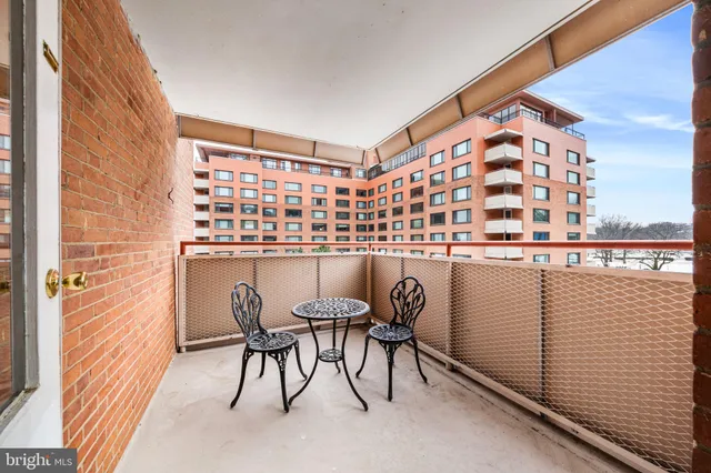 a view of a balcony with chairs