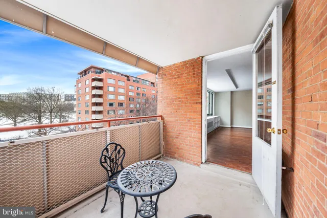 a view of a hallway with seating area