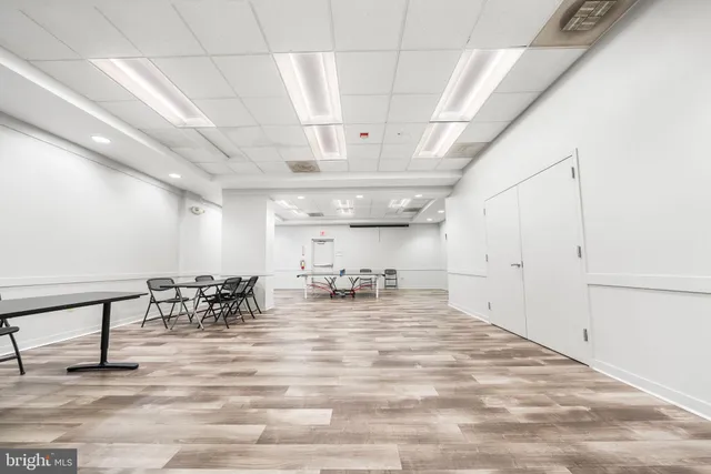 a room with gym equipment and lots of equipment