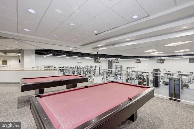 a view of street with tall buildings and a street sign
