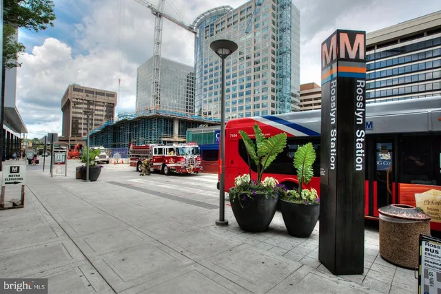 a view of a house with a swimming pool and sitting area