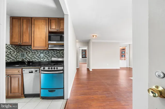 a kitchen with stainless steel appliances granite countertop a stove and a sink
