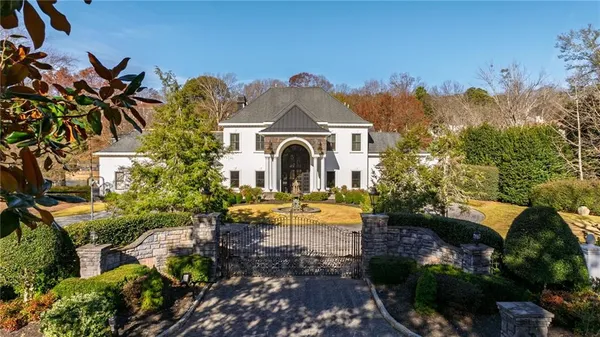 an aerial view of a house with swimming pool