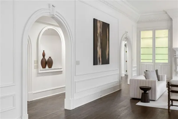 a kitchen with a sink cabinets and wooden floor