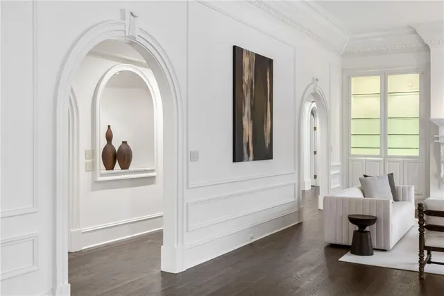 a kitchen with a sink cabinets and wooden floor