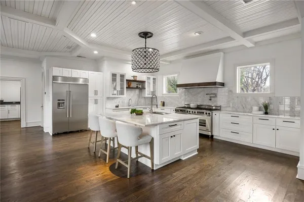 a kitchen with a stove and a window
