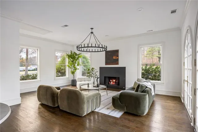 a spacious bathroom with a granite countertop sink and a mirror