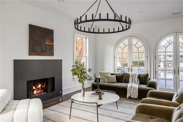 a spacious bathroom with a window and a chandelier