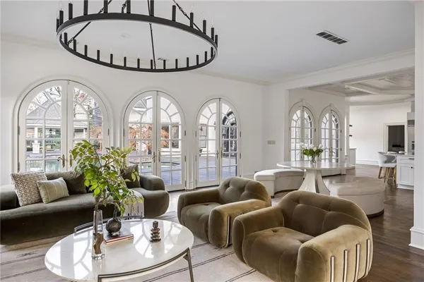 a bathroom with a double vanity sink a mirror and a bathtub