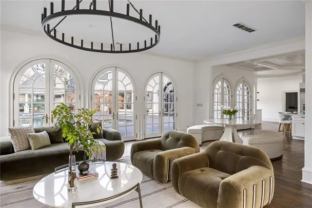 a bathroom with a double vanity sink a mirror and a bathtub