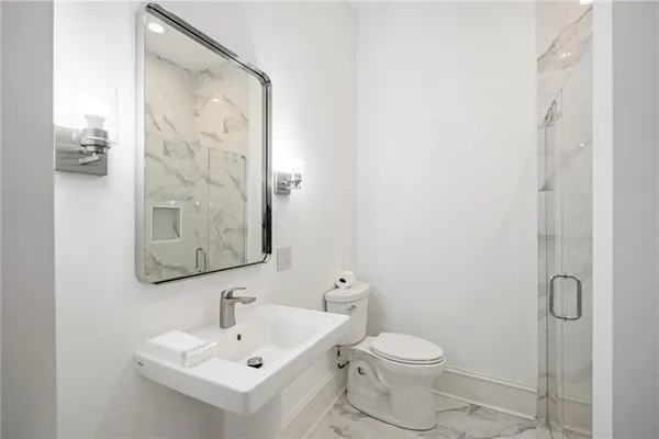 a spacious bathroom with a double vanity sink and a mirror