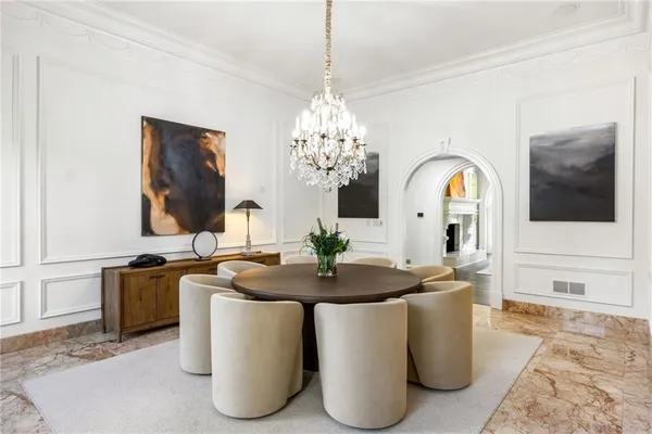 a spacious bathroom with a bathtub a sink and a window