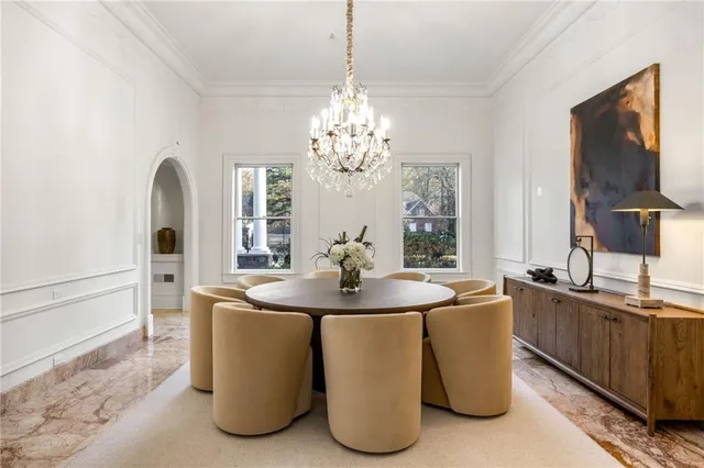 a bathroom with a granite countertop sink a mirror and shower