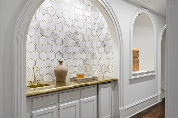a bathroom with a bathtub a sink and a vanity