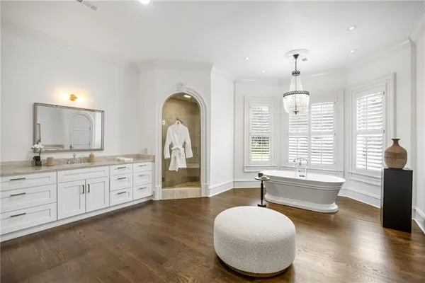 a view of a house with pool and sitting area