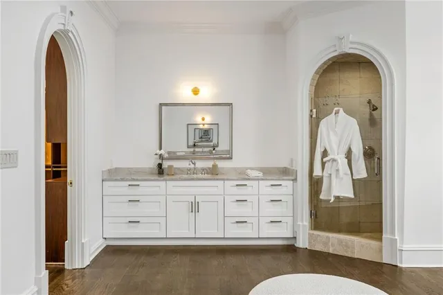 a view of a yard with plants and trees