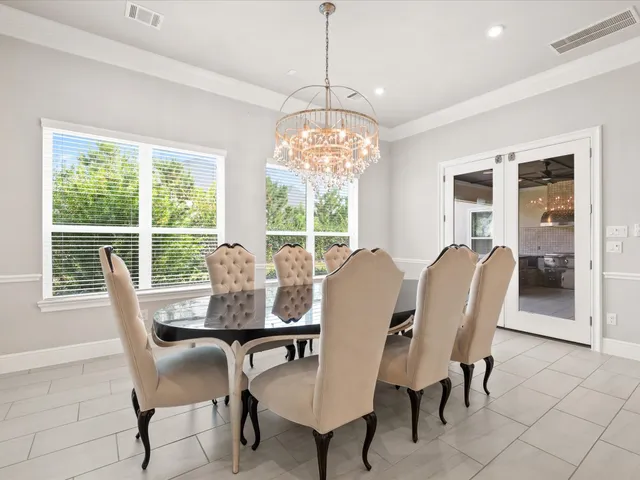 a view of a livingroom with furniture a flat screen tv and staircase
