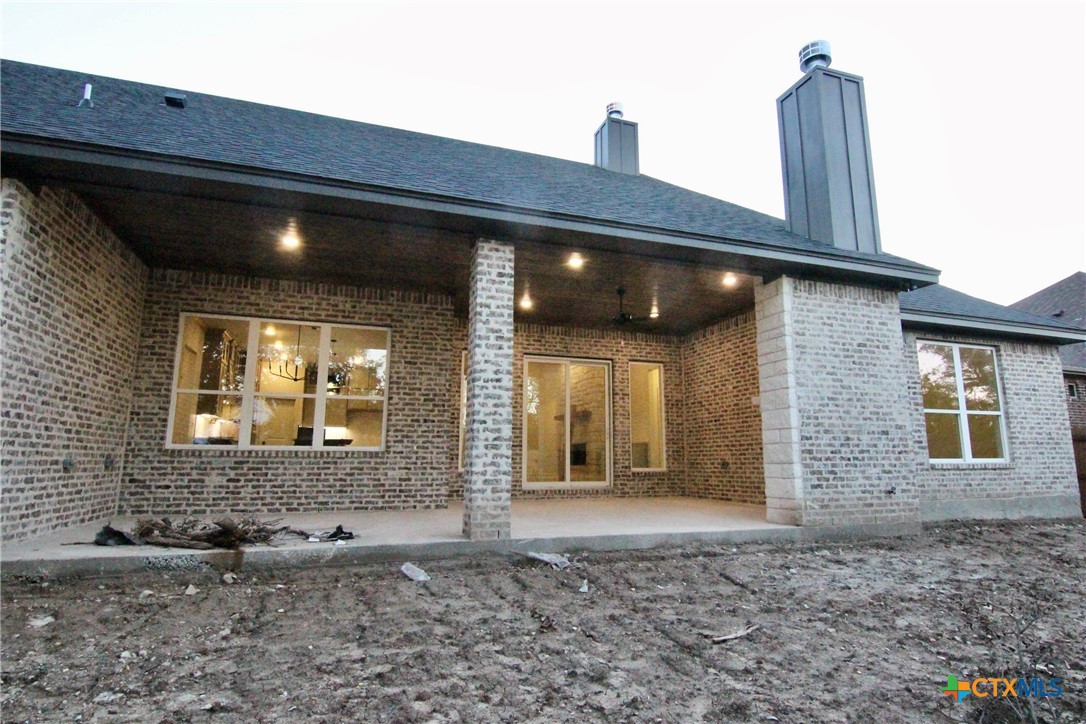5809 Whippoorwill Road Temple, TX 76502 - Photo 5 of 5 a view of a brick house with floor to ceiling windows