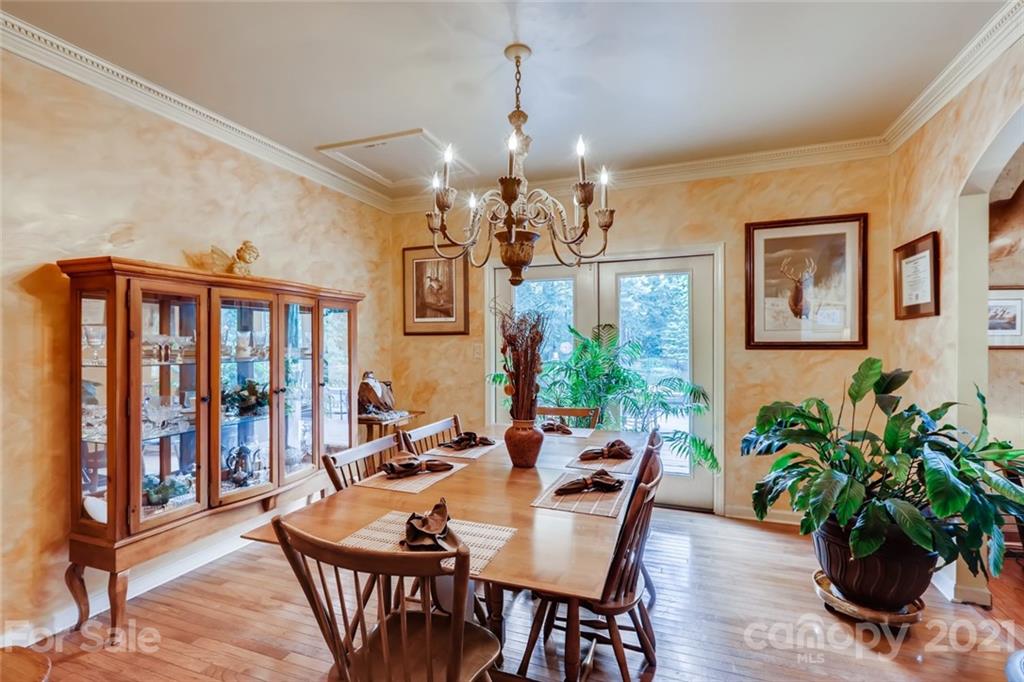 5508 Griffith Road Monroe, NC 28112 - Photo 15 of 48 a view of a dining room with furniture window and wooden floor