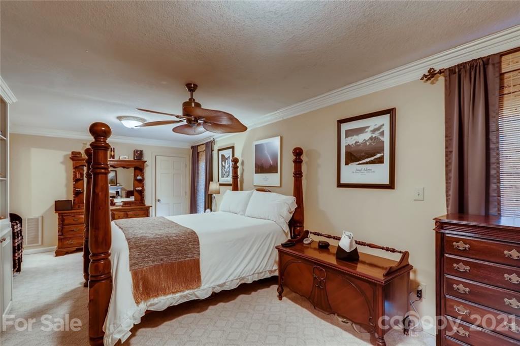 5508 Griffith Road Monroe, NC 28112 - Photo 21 of 48 a bedroom with a bed and wooden floor