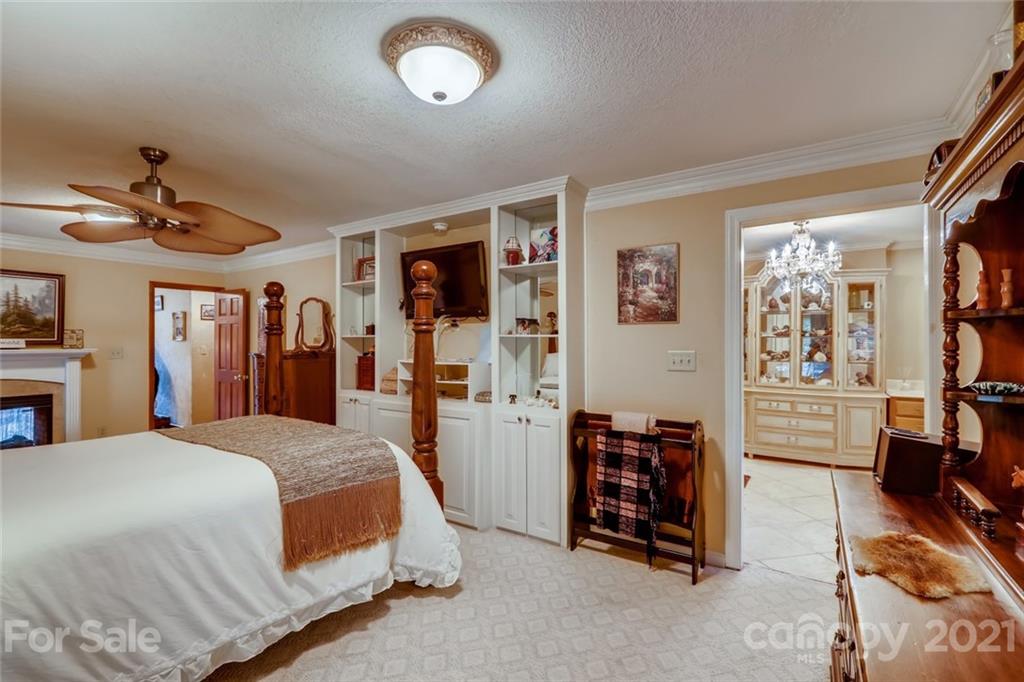 5508 Griffith Road Monroe, NC 28112 - Photo 23 of 48 a spacious bedroom with a bed and a walk in closet
