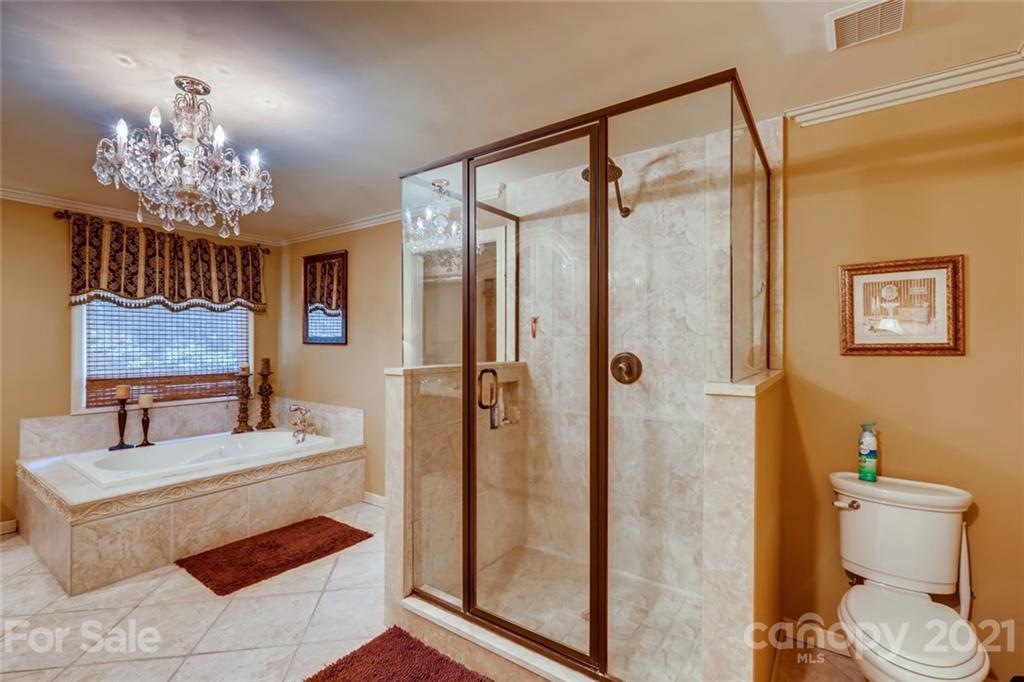 5508 Griffith Road Monroe, NC 28112 - Photo 25 of 48 a bathroom with a sink toilet and shower