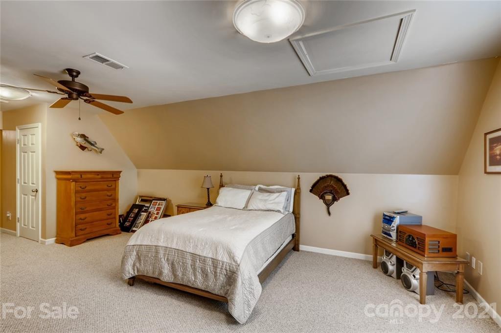 5508 Griffith Road Monroe, NC 28112 - Photo 30 of 48 a bedroom with a bed and a chair