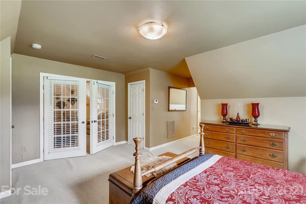 5508 Griffith Road Monroe, NC 28112 - Photo 32 of 48 a bedroom with a bed and a dresser