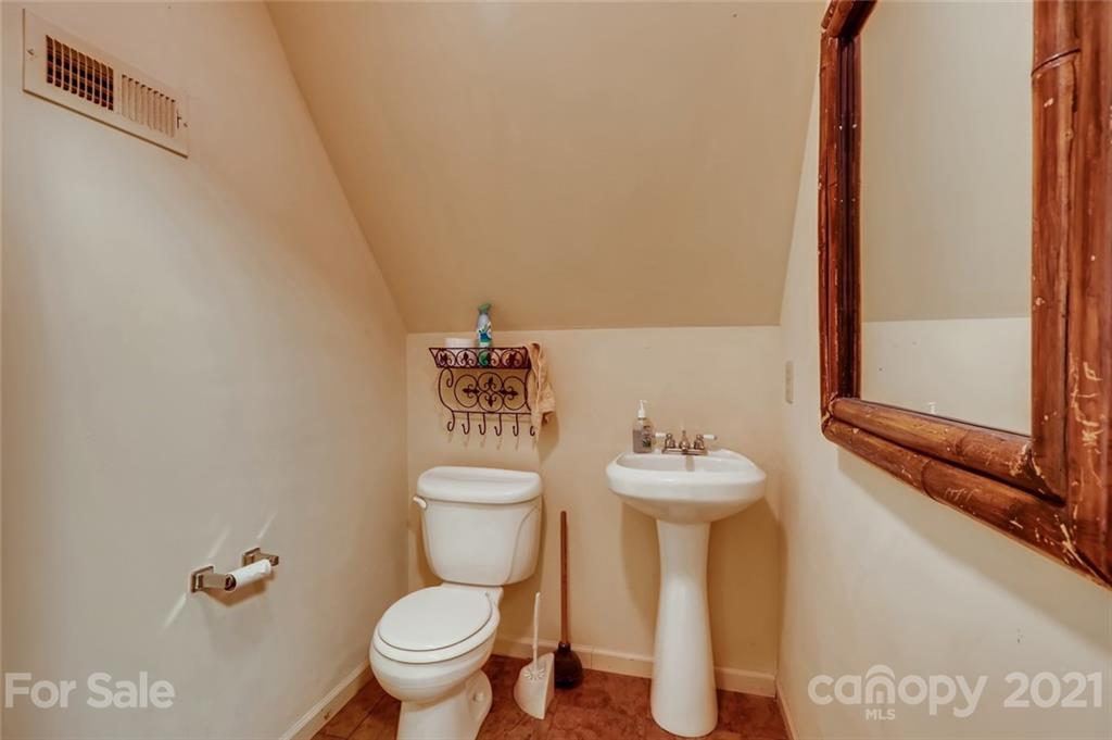 5508 Griffith Road Monroe, NC 28112 - Photo 34 of 48 a bathroom with a sink mirror and toilet