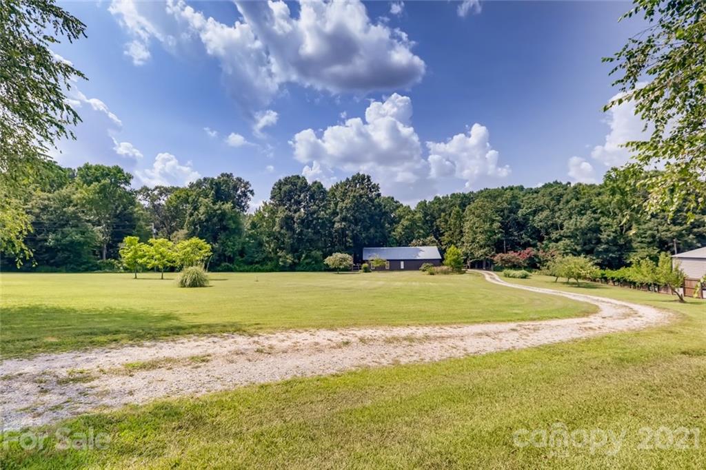 5508 Griffith Road Monroe, NC 28112 - Photo 39 of 48 a view of a golf course with a lake view