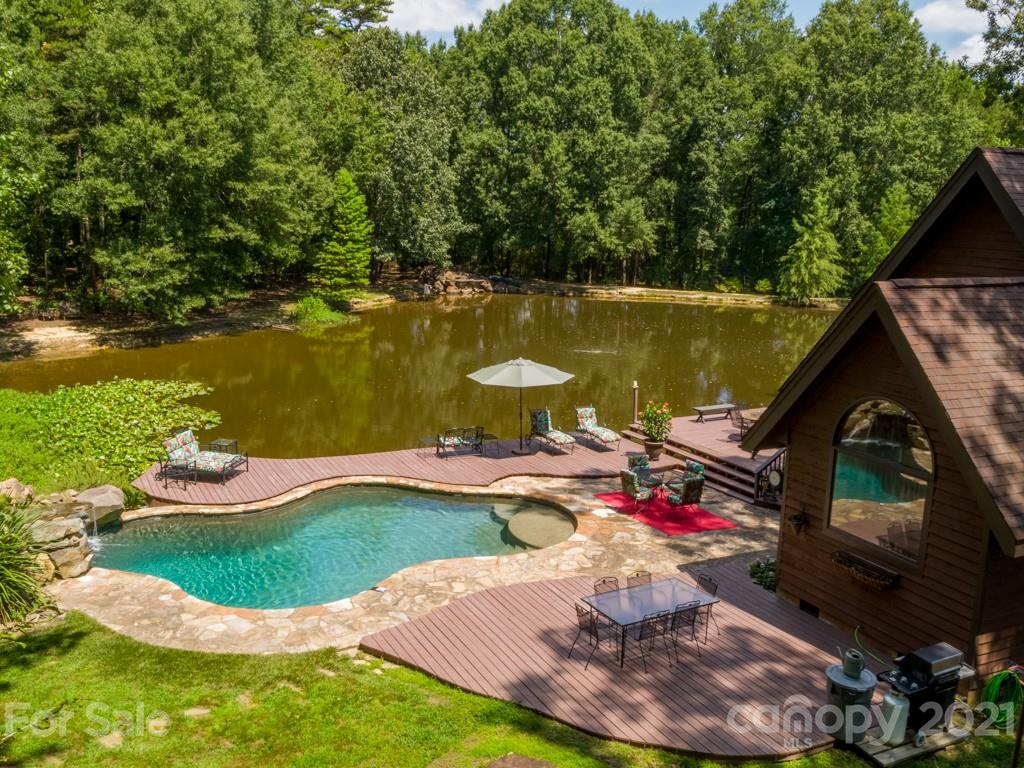 5508 Griffith Road Monroe, NC 28112 - Photo 5 of 48 a view of a swimming pool with a lake view