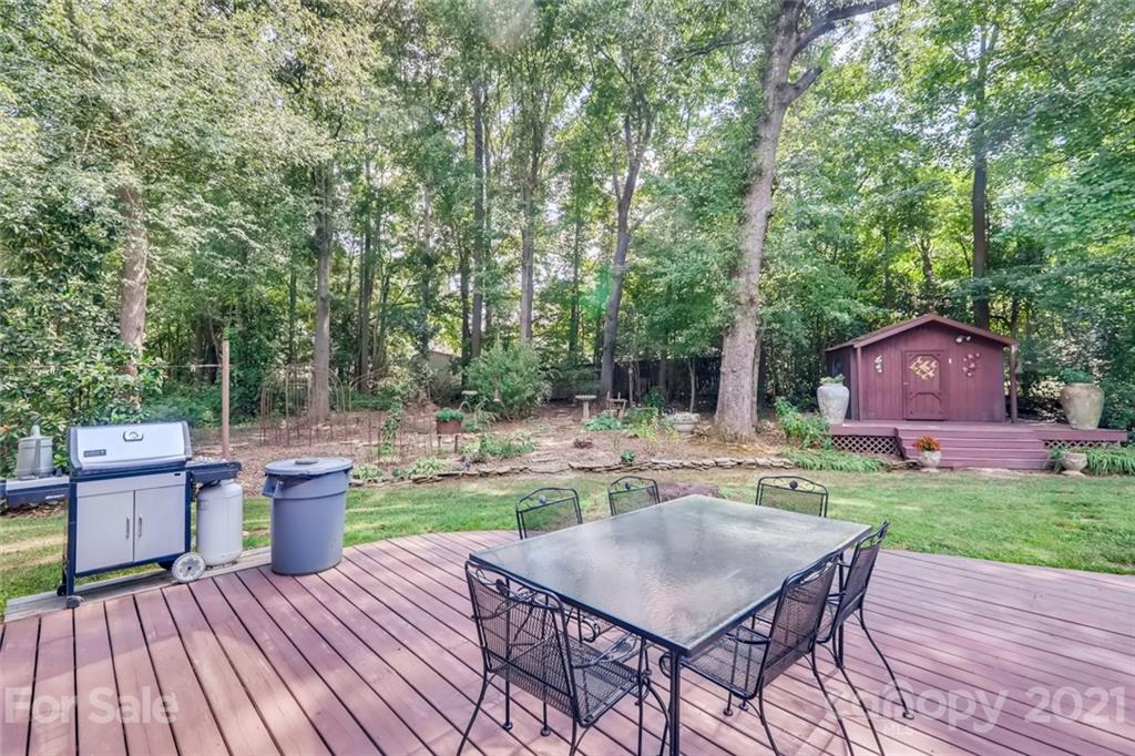 5508 Griffith Road Monroe, NC 28112 - Photo 42 of 48 a backyard of a house with table and chairs