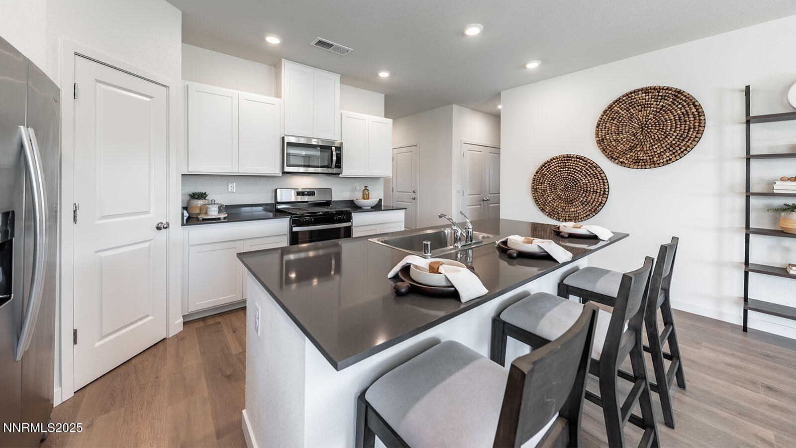 4536 Mifflin Street, Unit LOT #5 Fernley, NV 89408 - Photo 10 of 25 a kitchen with a table chairs and a refrigerator