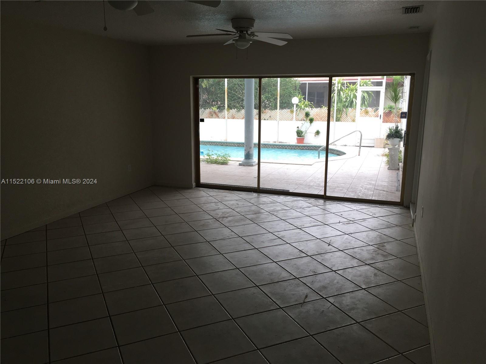 6737 Azalea Drive Miramar, FL 33023 - Photo 7 of 18 a view of an empty room and window