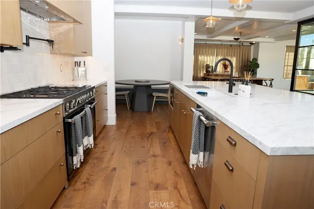 a kitchen with a stove and a sink