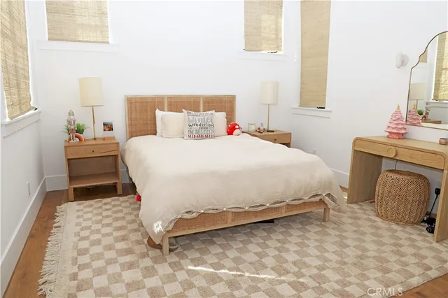 a bedroom with a bed and a chair