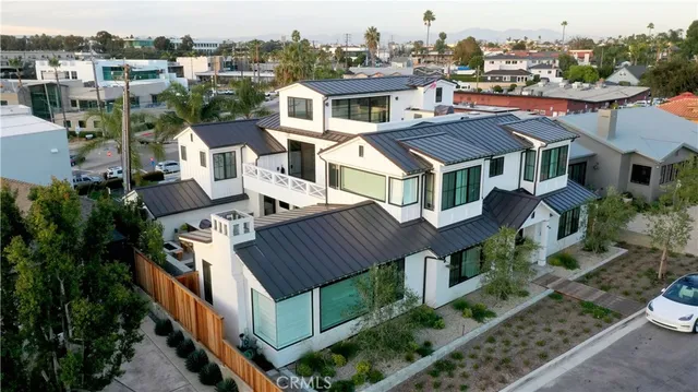 a aerial view of a house with a yard