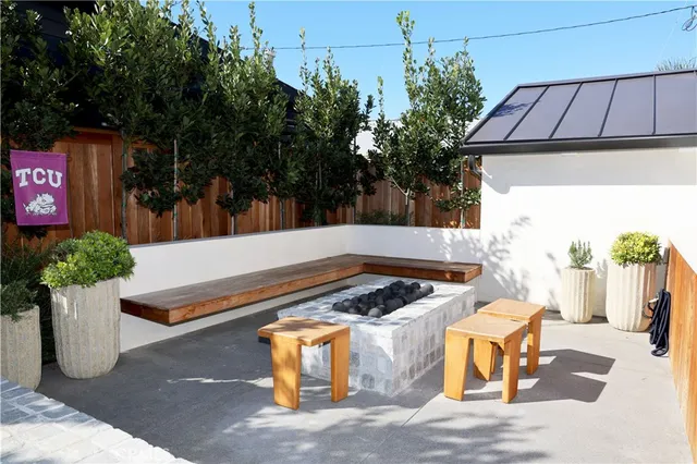 a view of a chairs and table in the patio