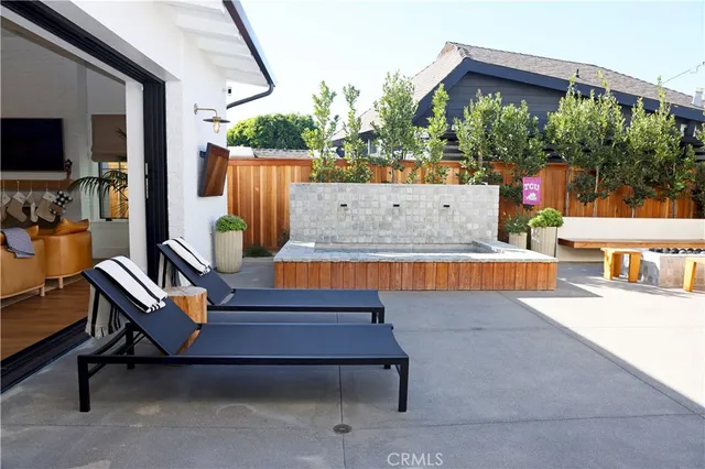 a reading room with wooden floor and outdoor seating