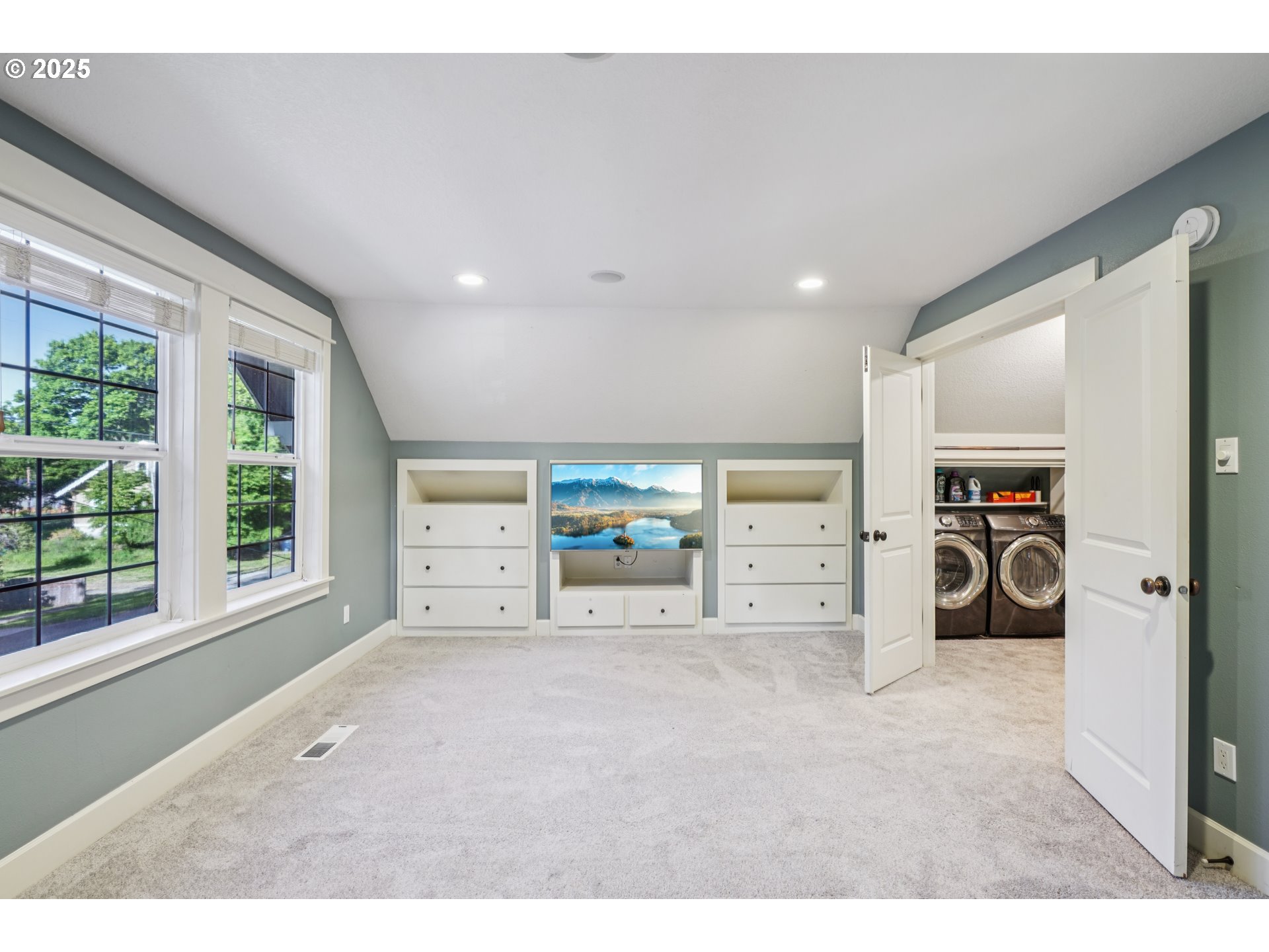 303 Maple Street Ridgefield, WA 98642 - Photo 19 of 36 a view of a livingroom with washer and dryer to ceiling window