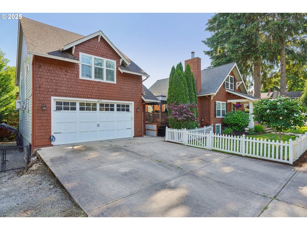 303 Maple Street Ridgefield, WA 98642 - Photo 26 of 36 a front view of a house with a yard and garage