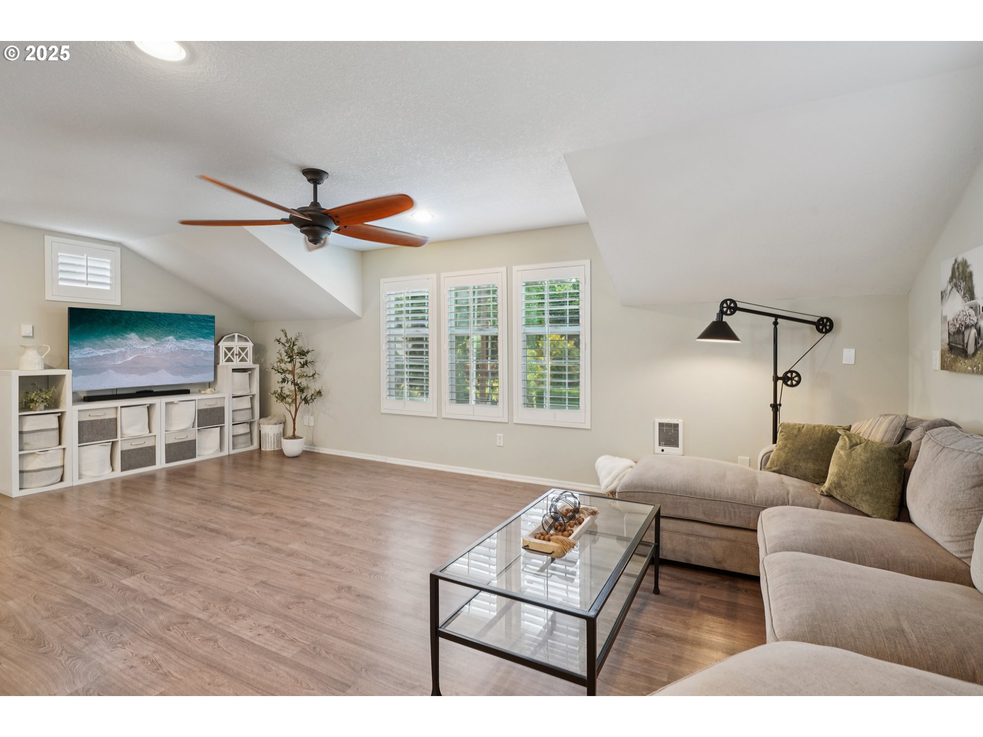 303 Maple Street Ridgefield, WA 98642 - Photo 29 of 36 a living room with furniture and a flat screen tv