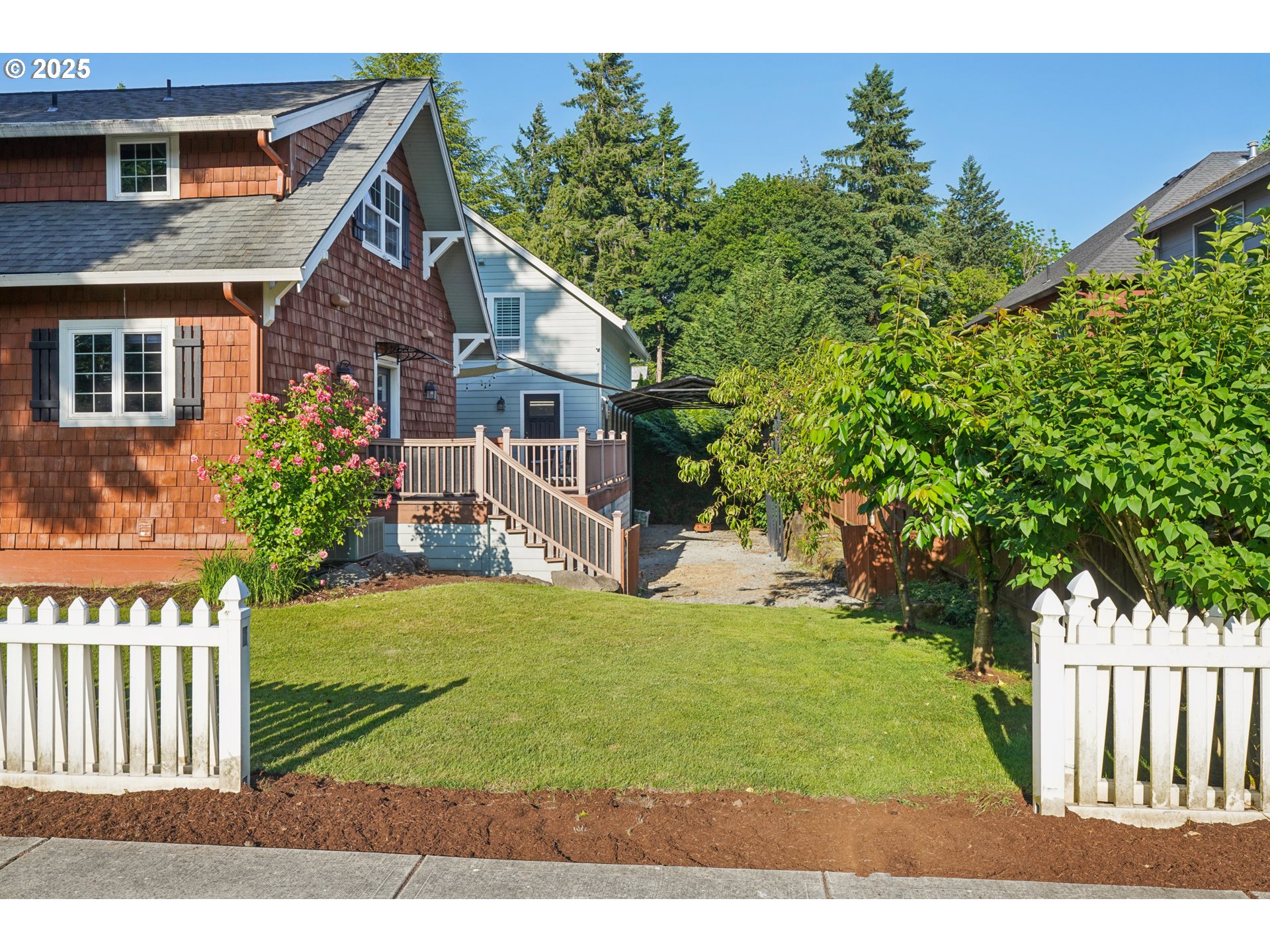 303 Maple Street Ridgefield, WA 98642 - Photo 3 of 36 a front view of a house with a yard