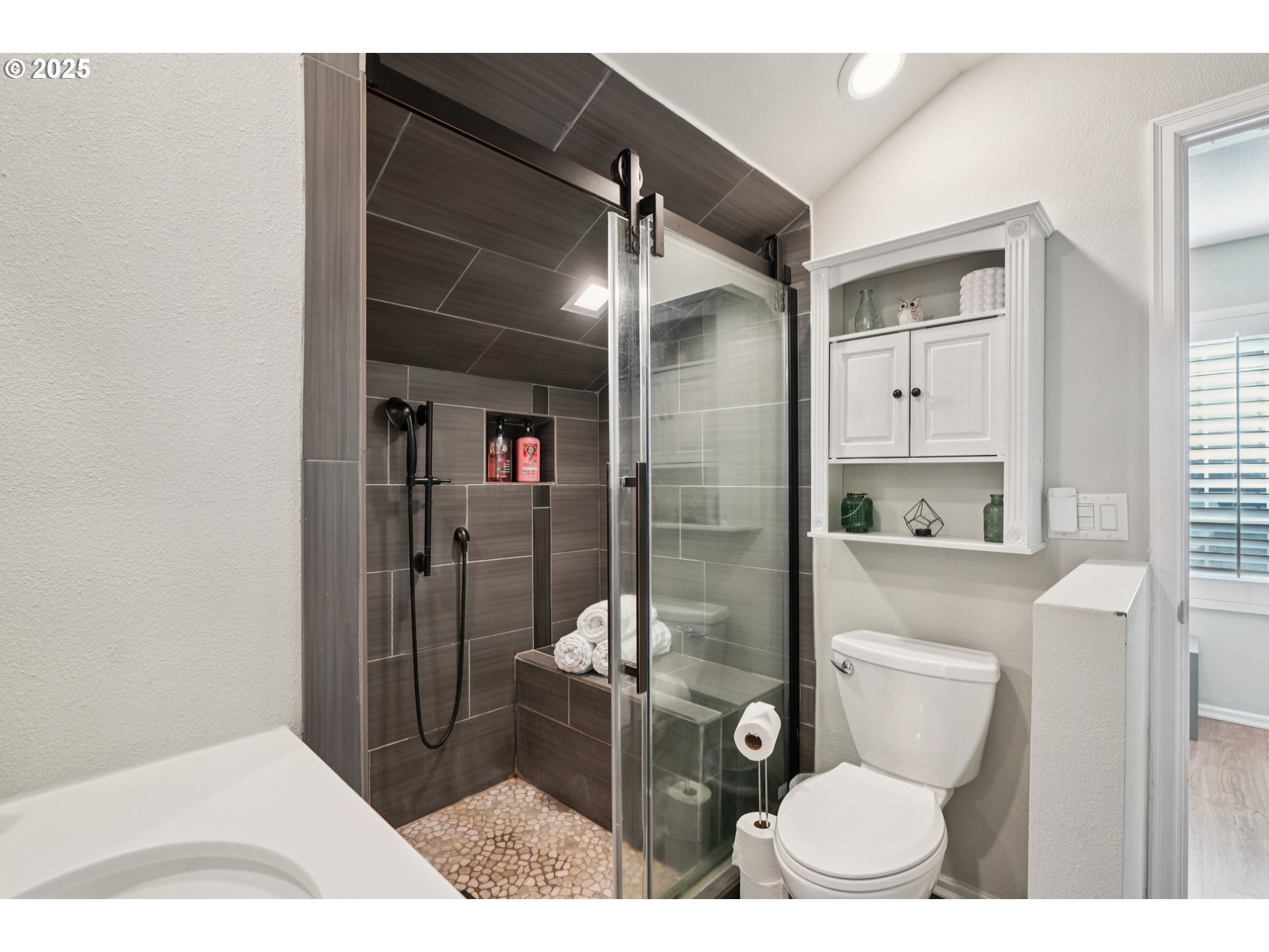 303 Maple Street Ridgefield, WA 98642 - Photo 33 of 36 a bathroom with a toilet and a shower
