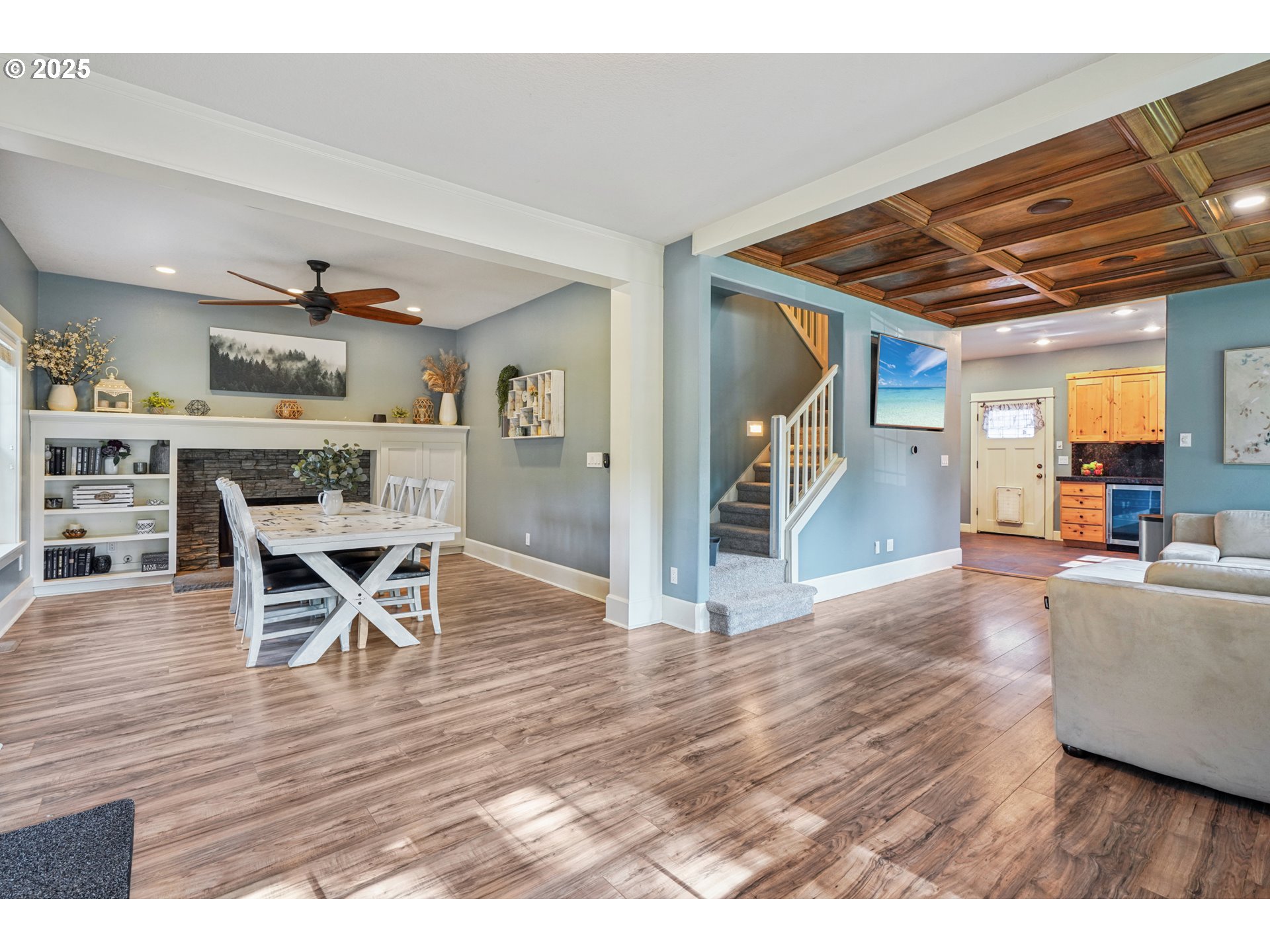 303 Maple Street Ridgefield, WA 98642 - Photo 9 of 36 a view of a dining room with furniture and wooden floor