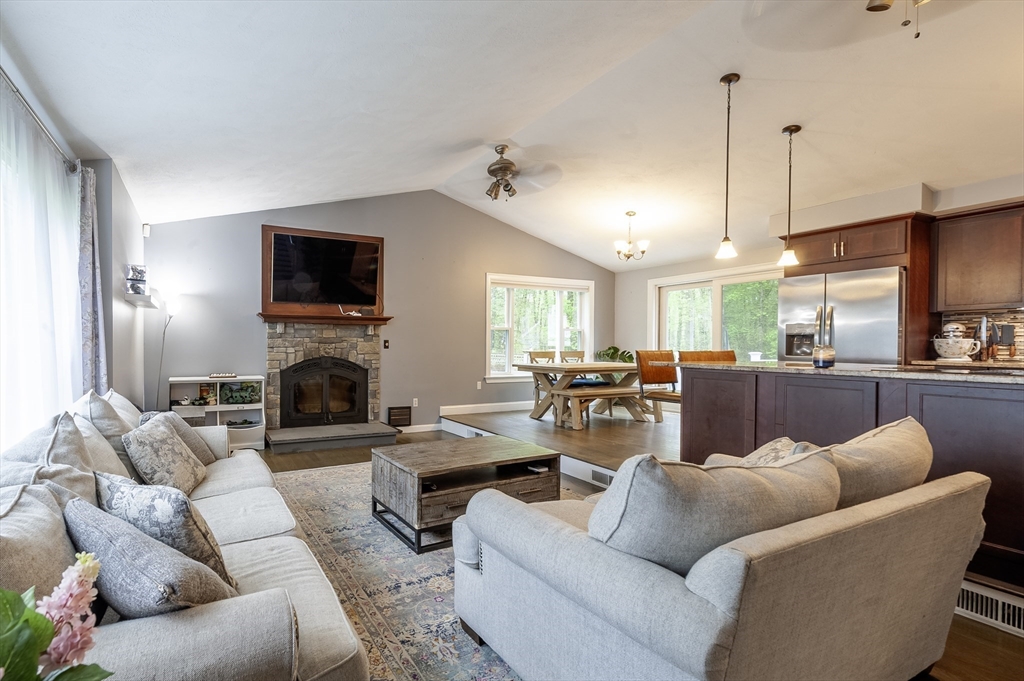 357 Ledge Road Seekonk, MA 02771 - Photo 17 of 42 a living room with furniture a fireplace and a flat screen tv