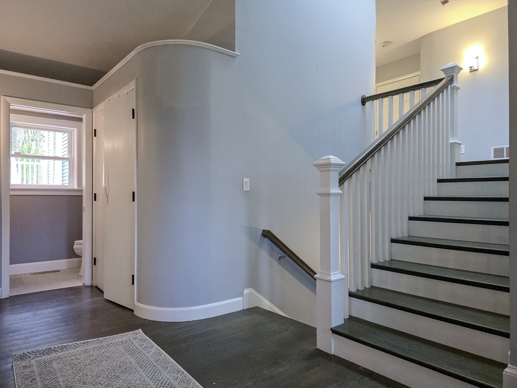 357 Ledge Road Seekonk, MA 02771 - Photo 19 of 42 a view of entryway with wooden floor and stairs