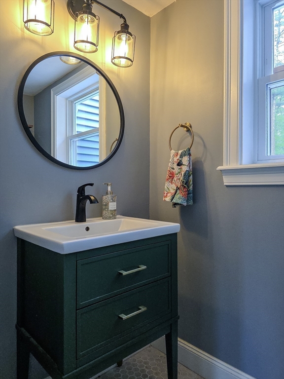 357 Ledge Road Seekonk, MA 02771 - Photo 22 of 42 a bathroom with a sink and a mirror