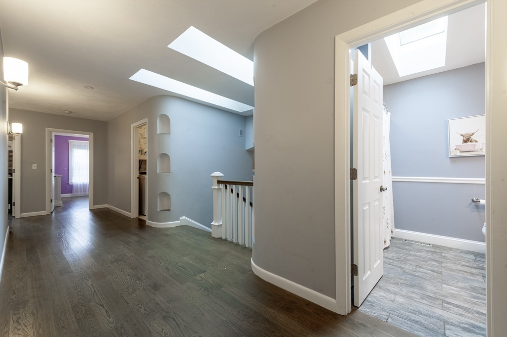 357 Ledge Road Seekonk, MA 02771 - Photo 24 of 42 a view of a hallway with wooden floor