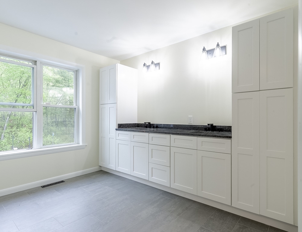 357 Ledge Road Seekonk, MA 02771 - Photo 27 of 42 a bathroom with a sink and a mirror
